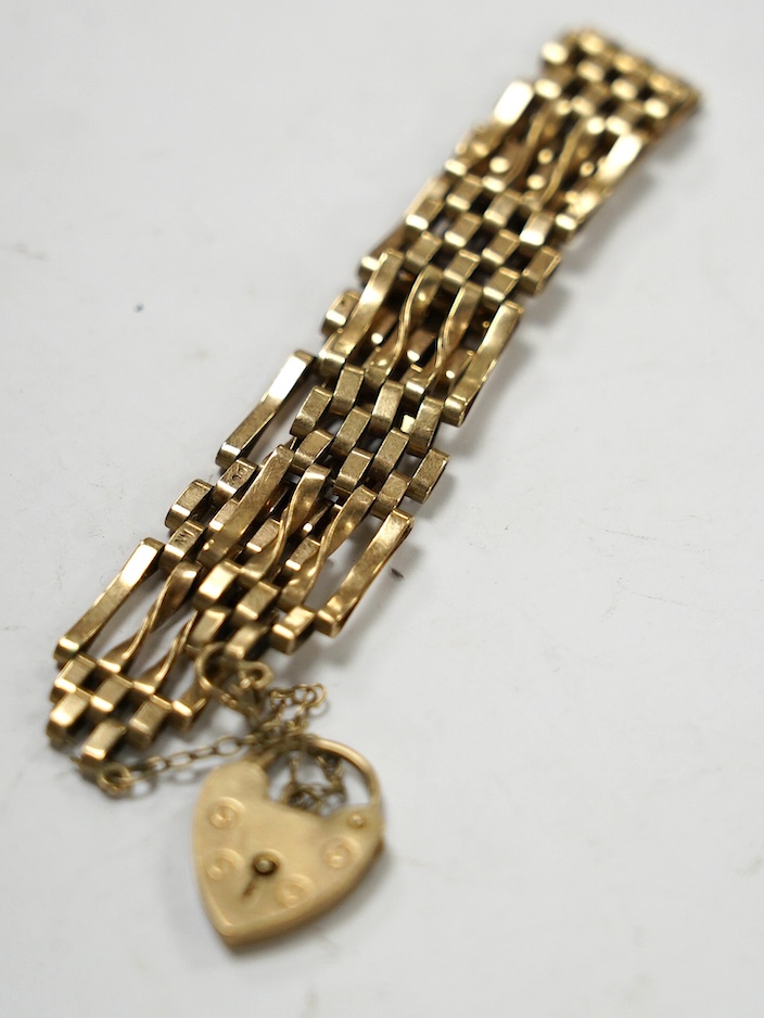 A 1970's 9ct gold gate link bracelet, with heart shaped padlock clasp, 16cm, 14.7 grams. Condition - poor to fair